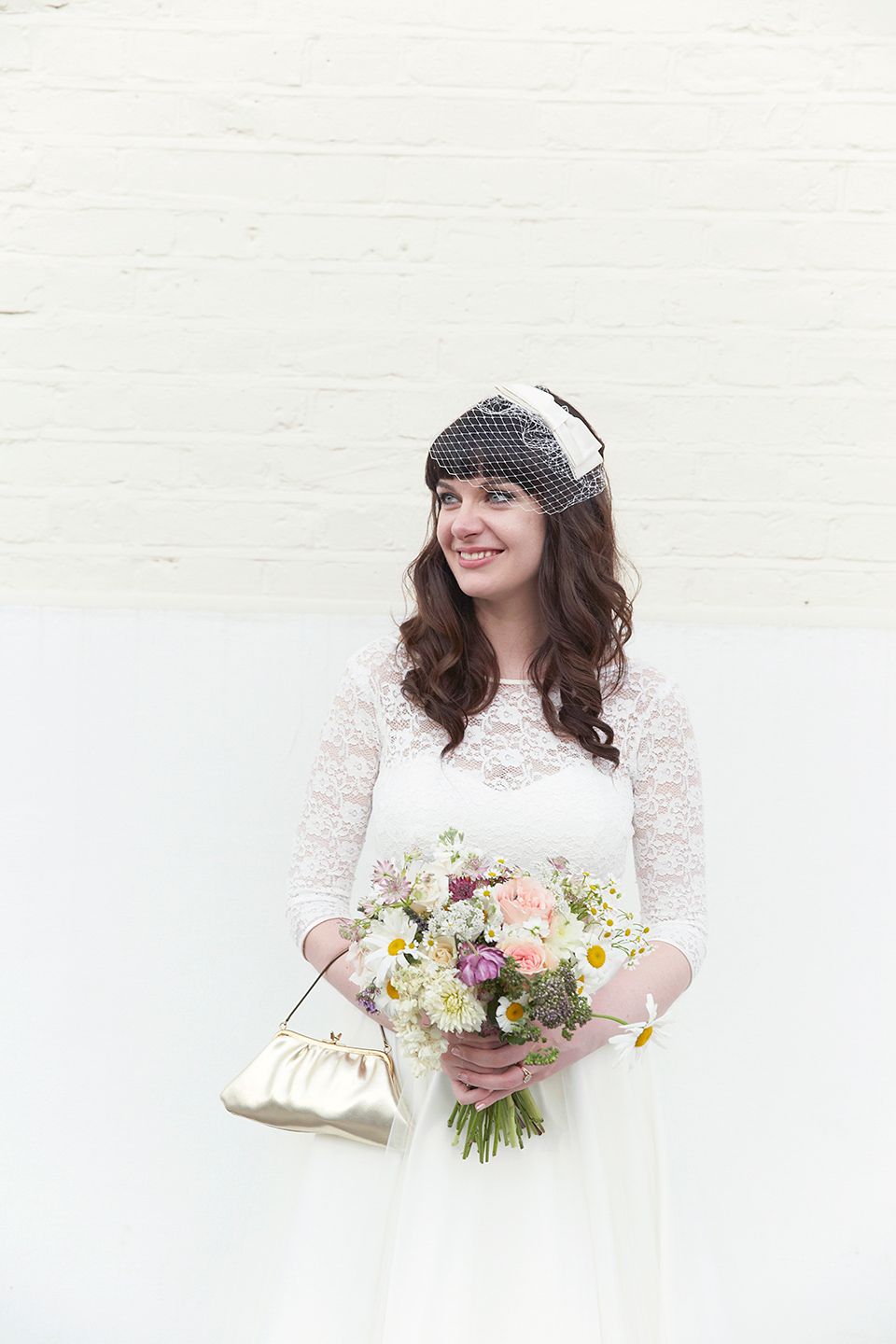 A 50's inspired tea-length dress for a pastel colour London pub wedding. Photography by Natalie J. Weddings.