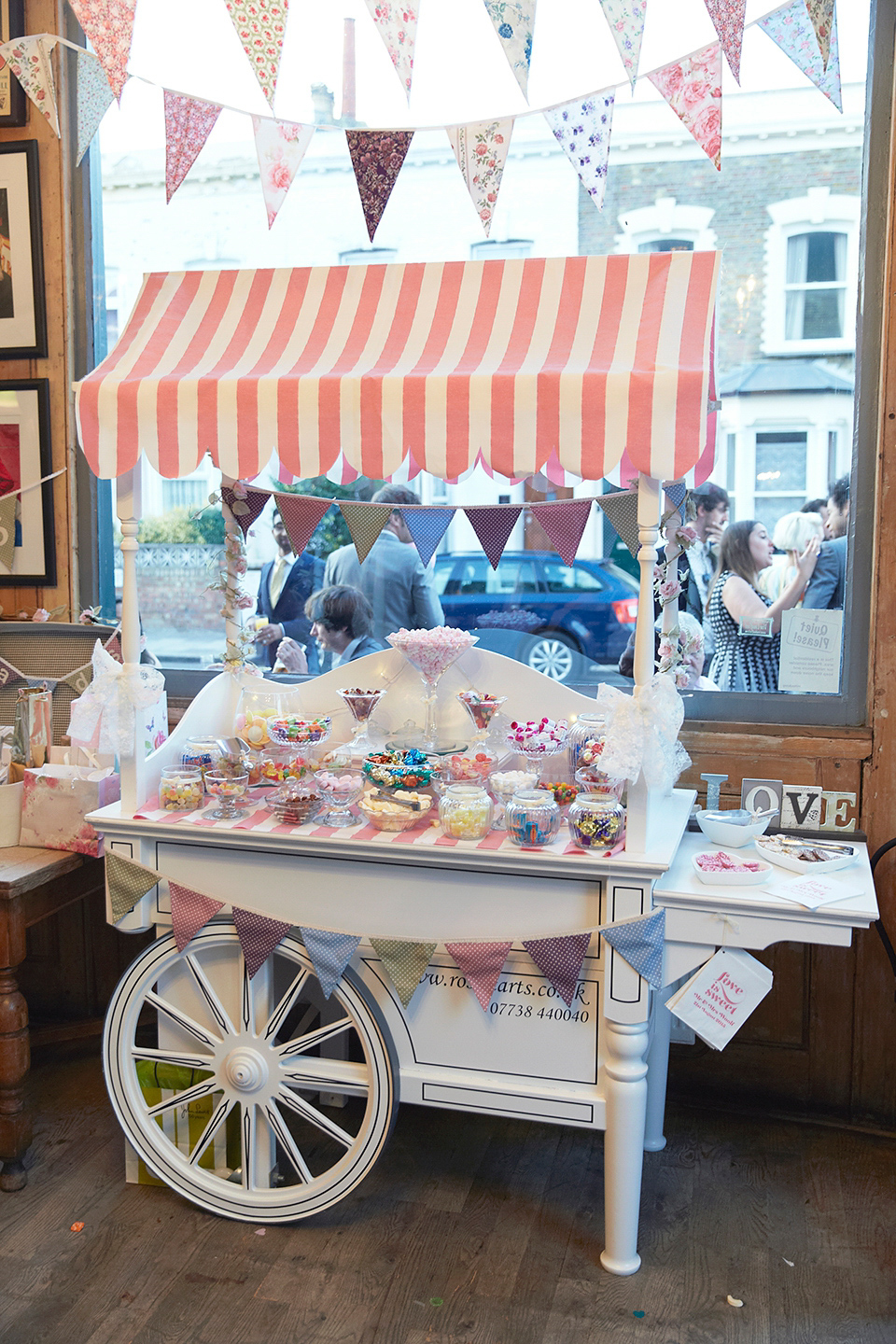 A 50's inspired tea-length dress for a pastel colour London pub wedding. Photography by Natalie J. Weddings.