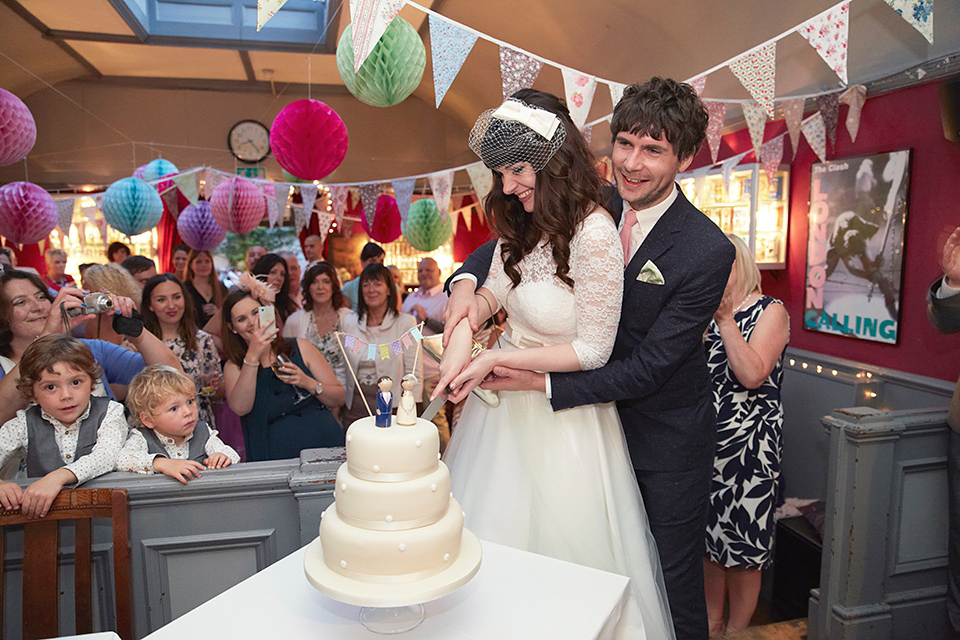 A 50's inspired tea-length dress for a pastel colour London pub wedding. Photography by Natalie J. Weddings.