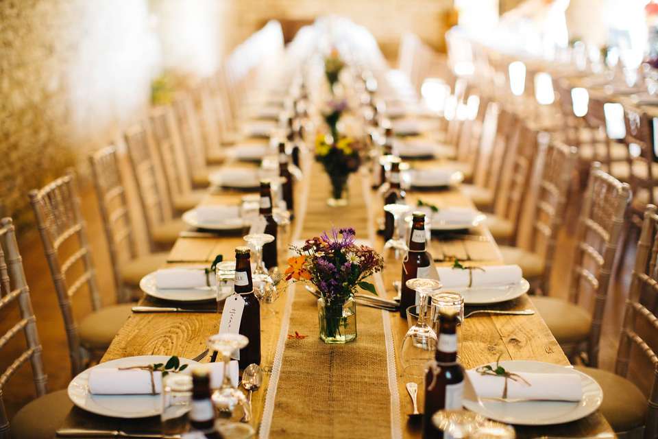 Leila wore a bespoke gown by dressmaker Dana Bolton for her rustic, homespun Autumn barn wedding. Photography by Richard Skins.