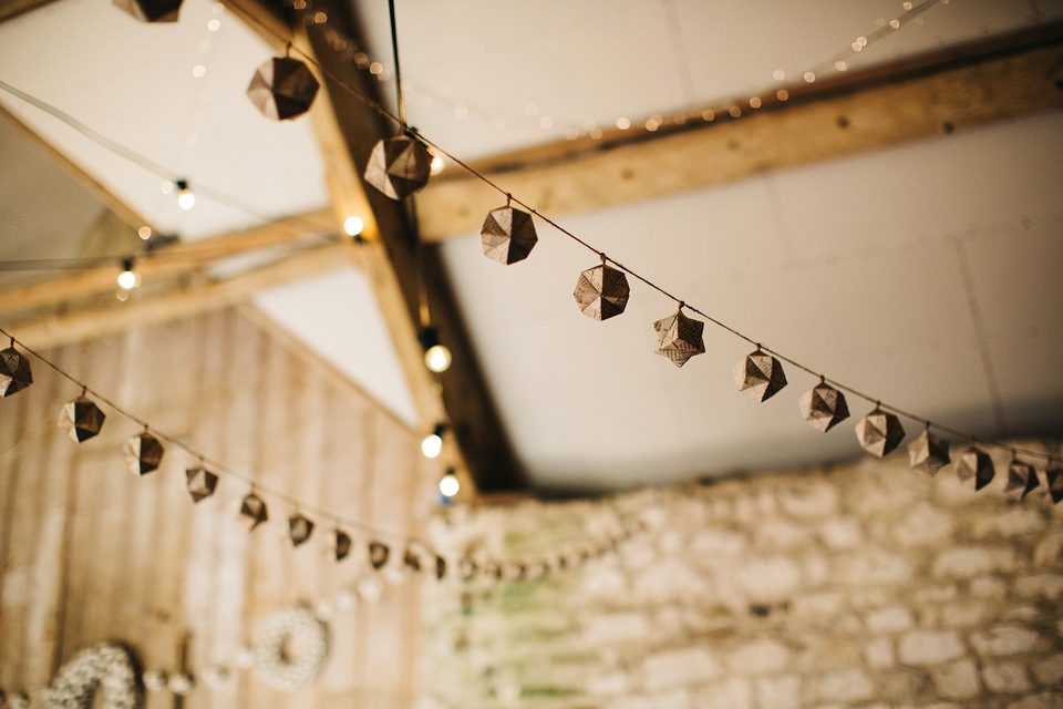 Leila wore a bespoke gown by dressmaker Dana Bolton for her rustic, homespun Autumn barn wedding. Photography by Richard Skins.