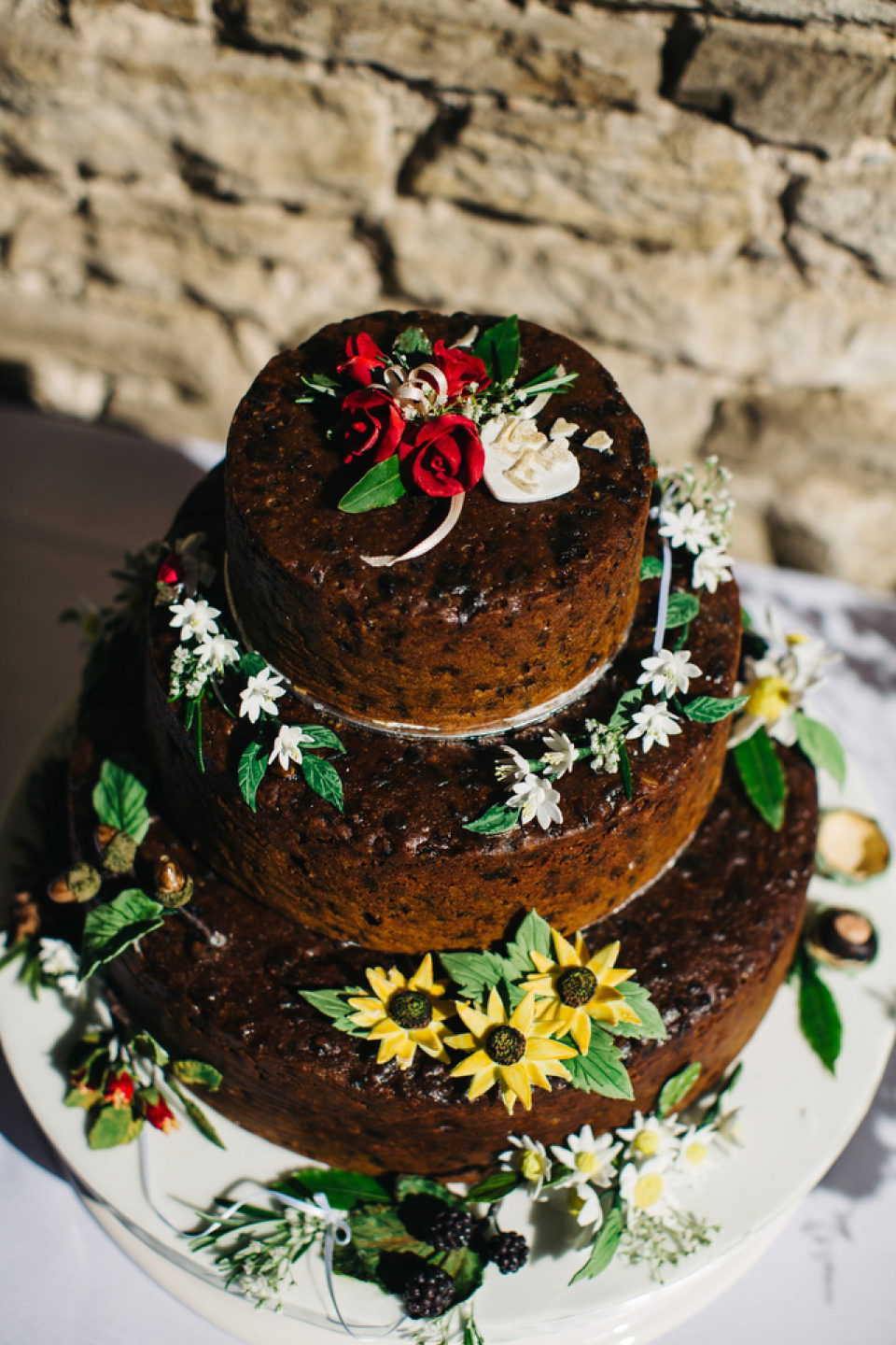 Leila wore a bespoke gown by dressmaker Dana Bolton for her rustic, homespun Autumn barn wedding. Photography by Richard Skins.