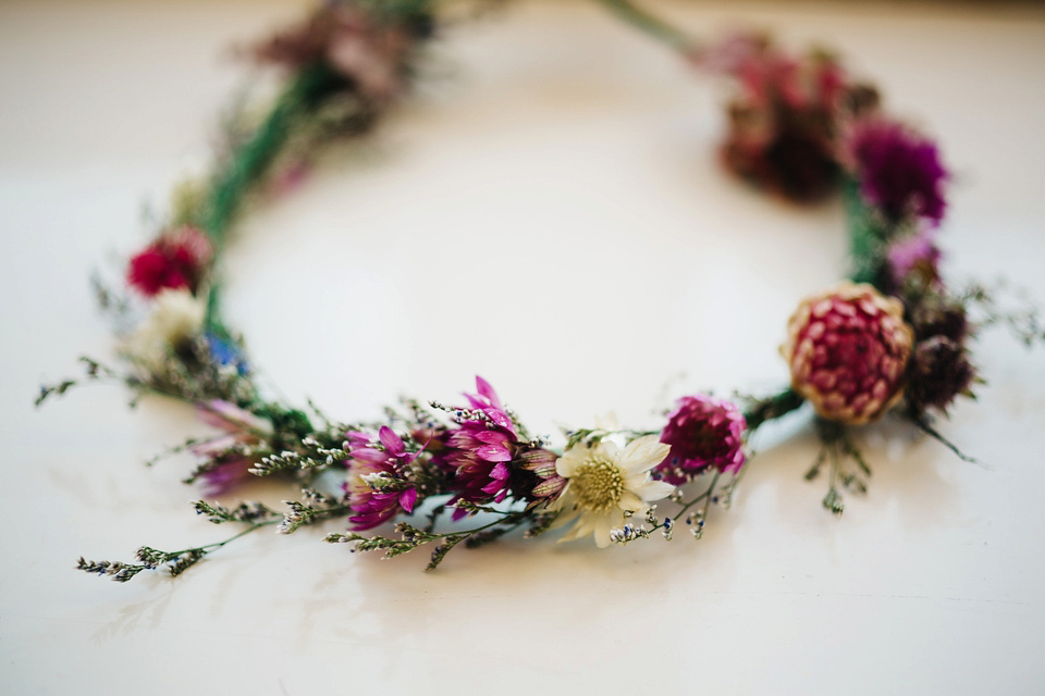 Leila wore a bespoke gown by dressmaker Dana Bolton for her rustic, homespun Autumn barn wedding. Photography by Richard Skins.