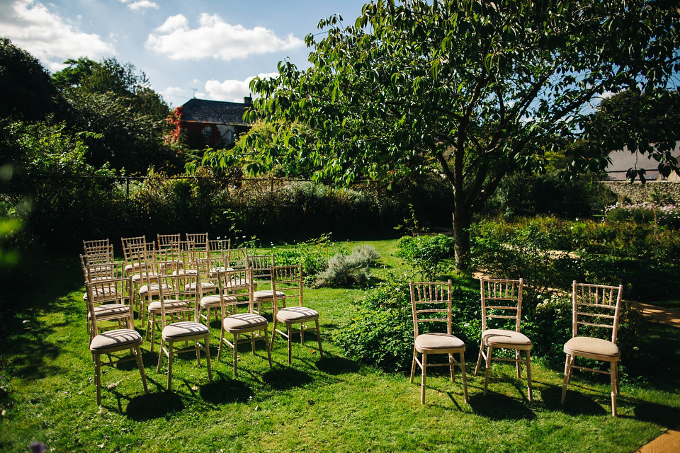 Leila wore a bespoke gown by dressmaker Dana Bolton for her rustic, homespun Autumn barn wedding. Photography by Richard Skins.