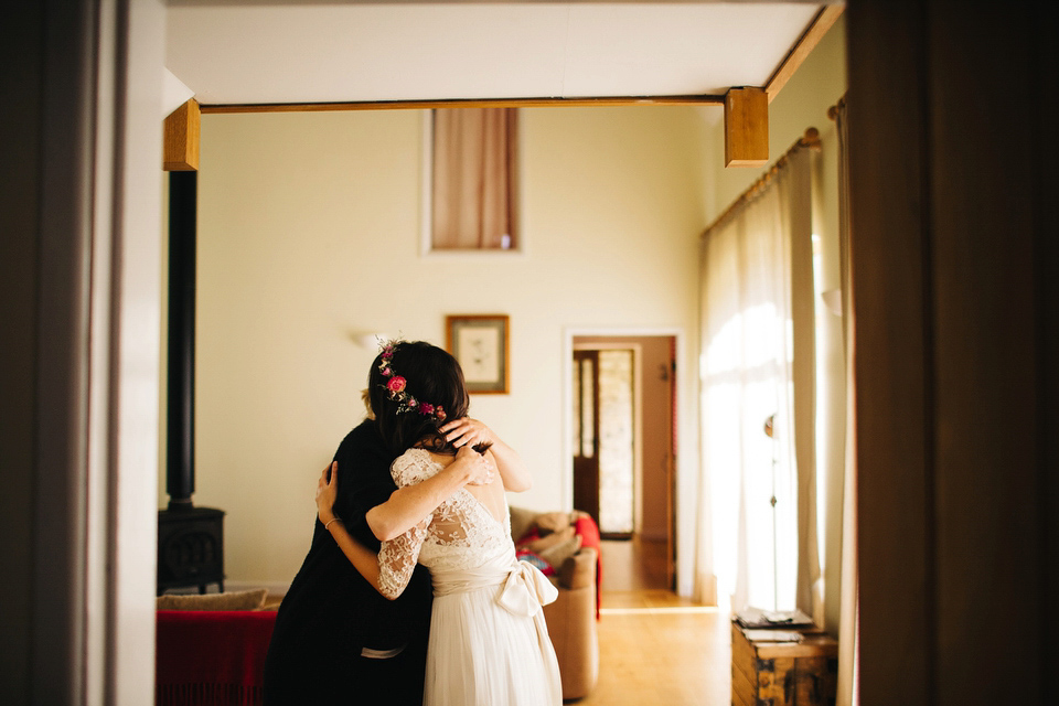 Leila wore a bespoke gown by dressmaker Dana Bolton for her rustic, homespun Autumn barn wedding. Photography by Richard Skins.