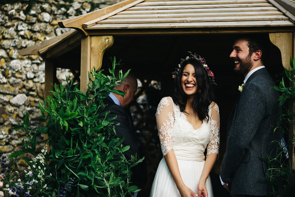 Leila wore a bespoke gown by dressmaker Dana Bolton for her rustic, homespun Autumn barn wedding. Photography by Richard Skins.