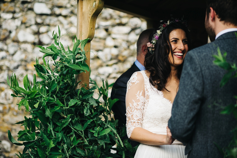 Leila wore a bespoke gown by dressmaker Dana Bolton for her rustic, homespun Autumn barn wedding. Photography by Richard Skins.