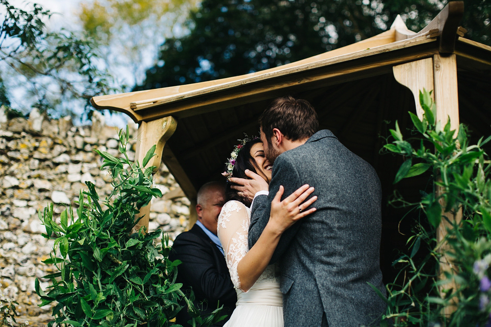 Leila wore a bespoke gown by dressmaker Dana Bolton for her rustic, homespun Autumn barn wedding. Photography by Richard Skins.