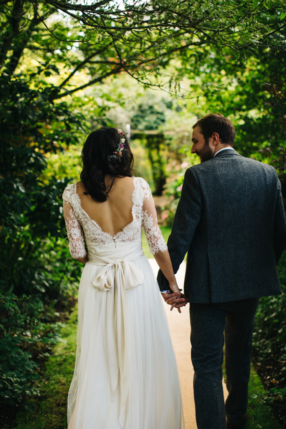 Leila wore a bespoke gown by dressmaker Dana Bolton for her rustic, homespun Autumn barn wedding. Photography by Richard Skins.