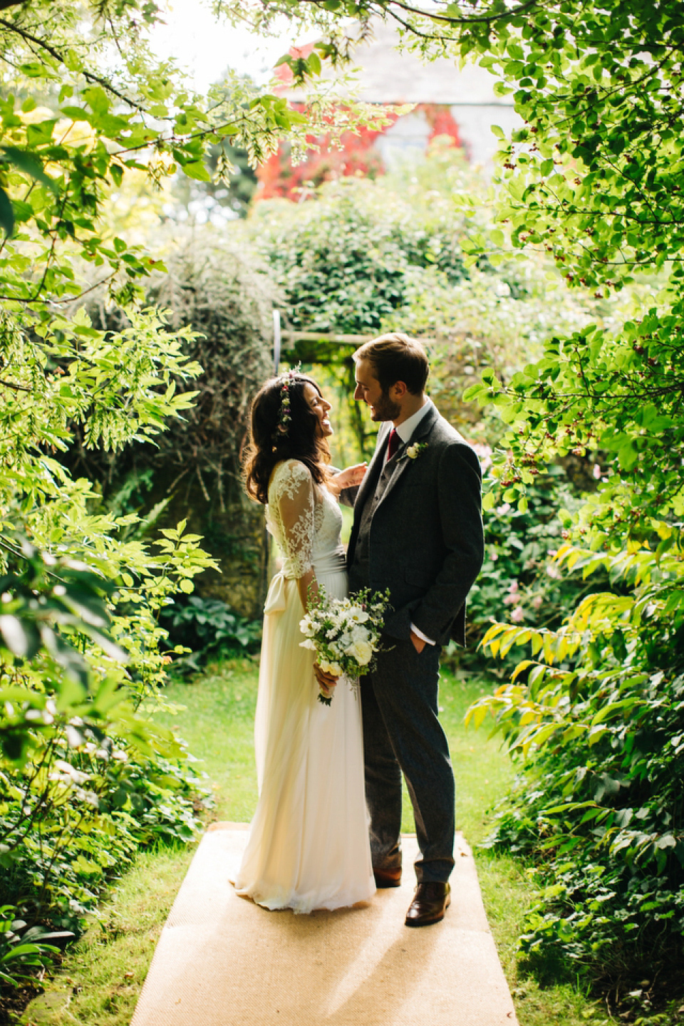 Leila wore a bespoke gown by dressmaker Dana Bolton for her rustic, homespun Autumn barn wedding. Photography by Richard Skins.