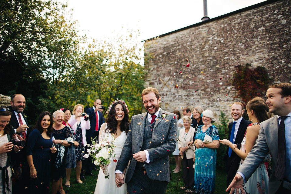 Leila wore a bespoke gown by dressmaker Dana Bolton for her rustic, homespun Autumn barn wedding. Photography by Richard Skins.