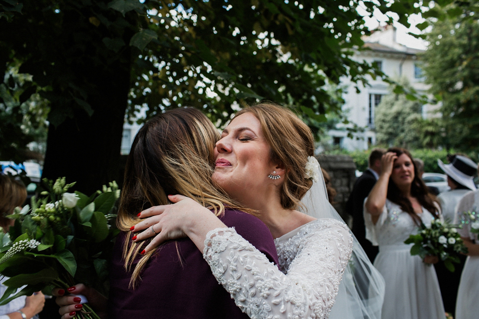 Victoria wears a backless, full-sleeved gown by Maria Senvo for her 1920's and Gatsby inspired London pub wedding. Photography by Hearts on Fire.