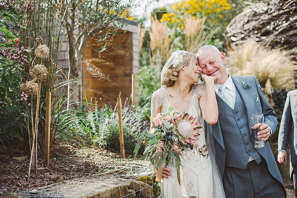 Jenny Packham glamour for a pale green pub wedding in Sussex. Photography by Razia N. Jukes.