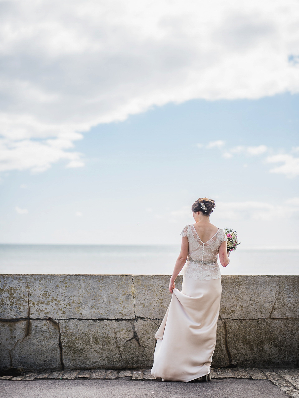 Verity wears a Halfpenny London gown for her garden party inspired wedding by the sea. Photography by John Barwood.