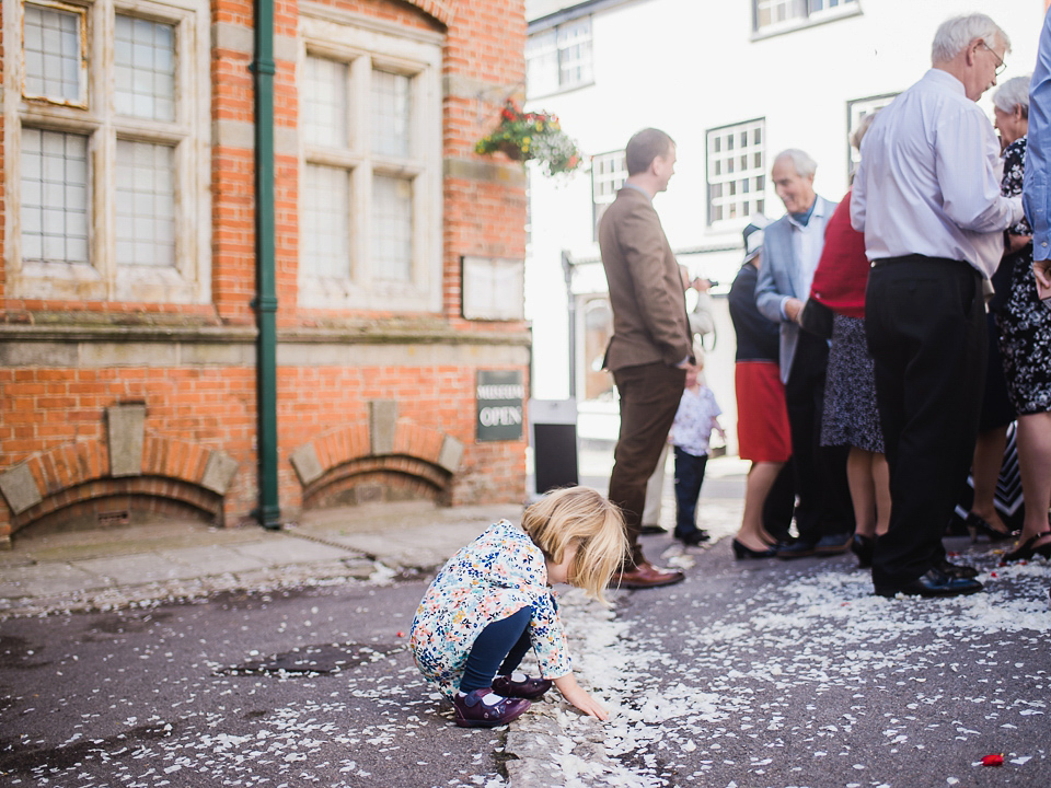 Verity wears a Halfpenny London gown for her garden party inspired wedding by the sea. Photography by John Barwood.