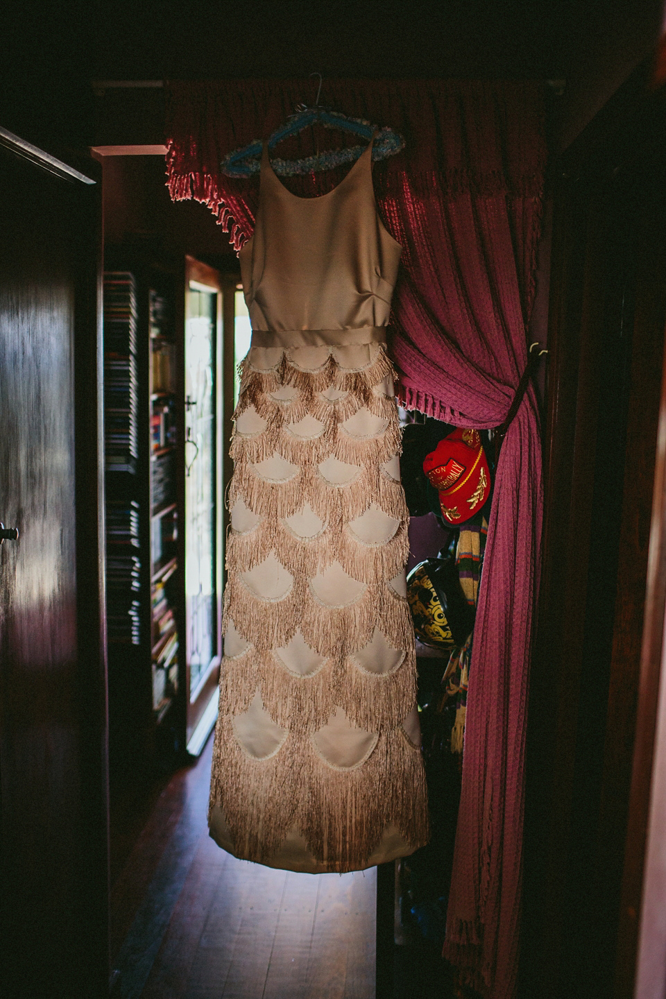 A 1920's flapper inspired wedding dress with tassels. Photography by Through The Woods We Ran.