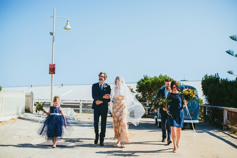 A 1920's flapper inspired wedding dress with tassels. Photography by Through The Woods We Ran.