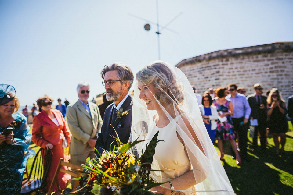 A 1920's flapper inspired wedding dress with tassels. Photography by Through The Woods We Ran.