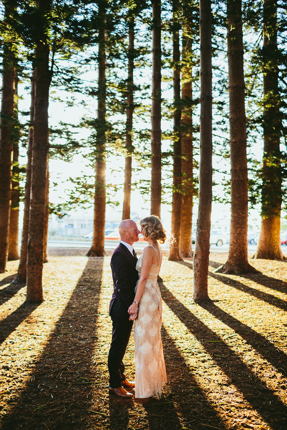 A 1920's flapper inspired wedding dress with tassels. Photography by Through The Woods We Ran.