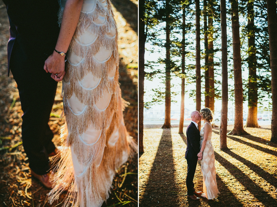 A 1920's flapper inspired wedding dress with tassels. Photography by Through The Woods We Ran.