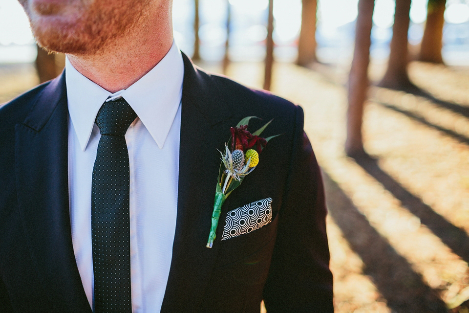 A 1920's flapper inspired wedding dress with tassels. Photography by Through The Woods We Ran.