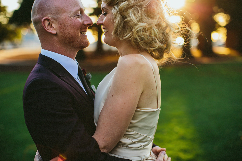 A 1920's flapper inspired wedding dress with tassels. Photography by Through The Woods We Ran.