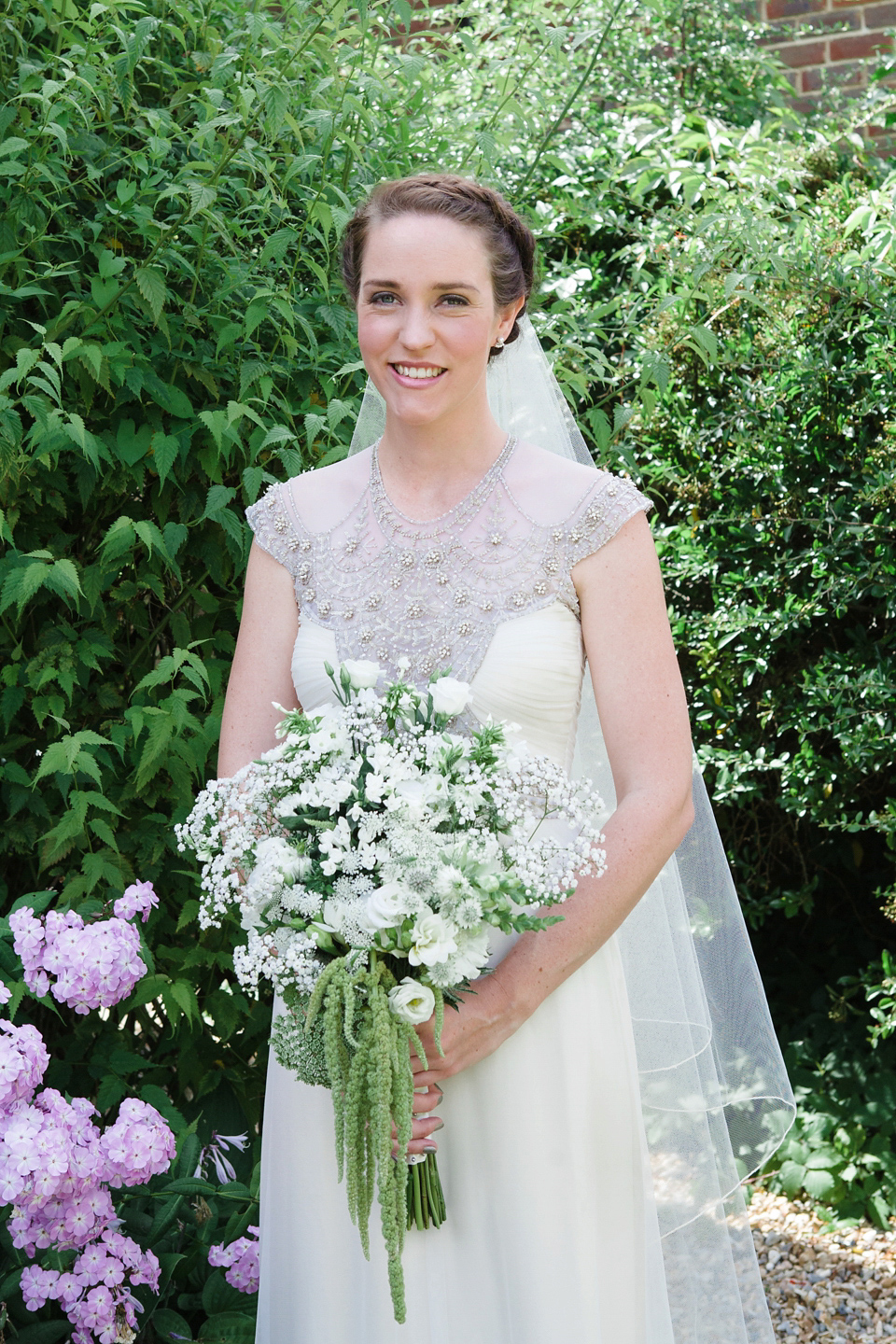 A glamorous Gwendolynne gown for a Summer garden party wedding. Photography by Lucy Davenport.