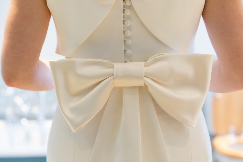 A modern and elegant Suzanne Neville gown for a Winter wonderland wedding.