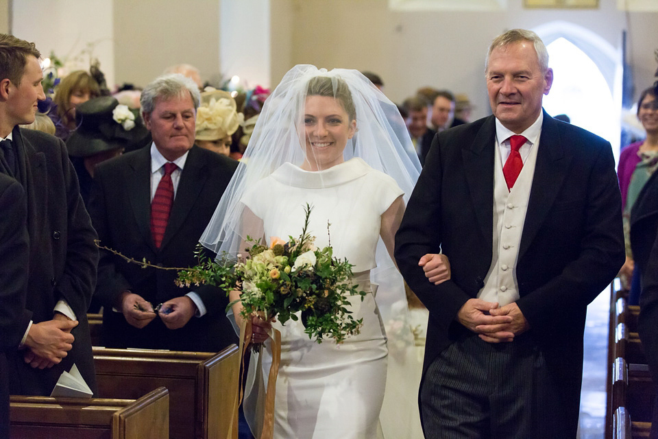 A modern and elegant Suzanne Neville gown for a Winter wonderland wedding.