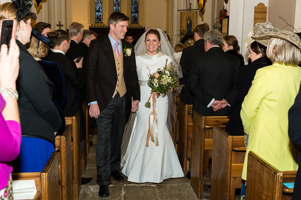 A modern and elegant Suzanne Neville gown for a Winter wonderland wedding.