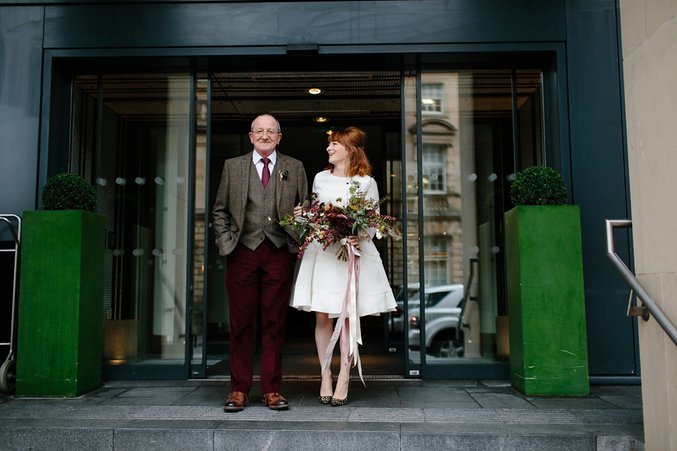 Lizzie wore a 1960's inspired short dress by Delphine Manivet for her intimate wedding in Edinburgh. Photography by Caro Weiss.