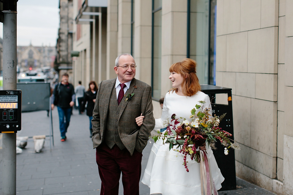 Lizzie wore a 1960's inspired short dress by Delphine Manivet for her intimate wedding in Edinburgh. Photography by Caro Weiss.