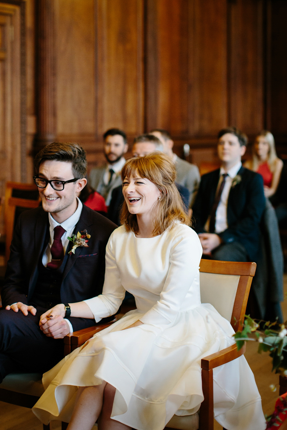 Lizzie wore a 1960's inspired short dress by Delphine Manivet for her intimate wedding in Edinburgh. Photography by Caro Weiss.