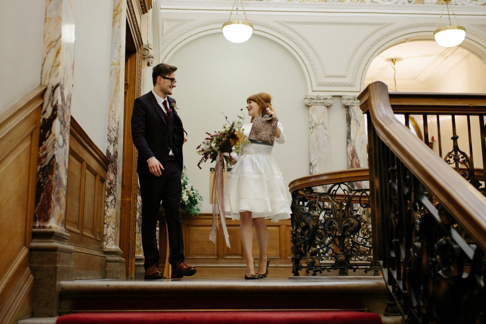 Lizzie wore a 1960's inspired short dress by Delphine Manivet for her intimate wedding in Edinburgh. Photography by Caro Weiss.