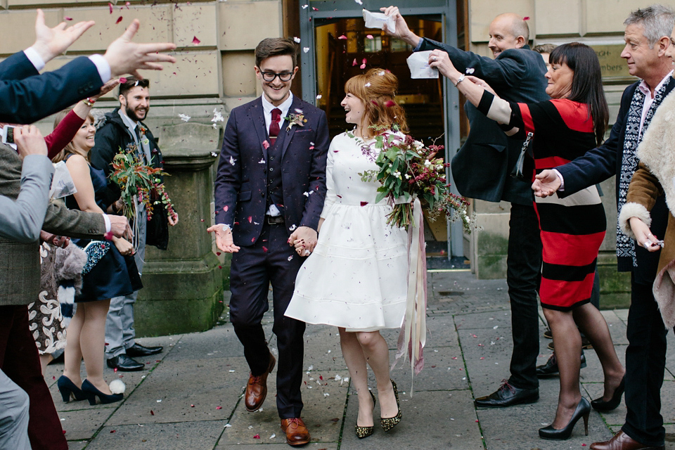 Lizzie wore a 1960's inspired short dress by Delphine Manivet for her intimate wedding in Edinburgh. Photography by Caro Weiss.