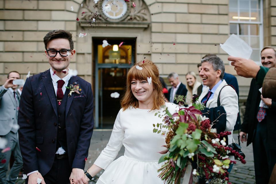 Lizzie wore a 1960's inspired short dress by Delphine Manivet for her intimate wedding in Edinburgh. Photography by Caro Weiss.