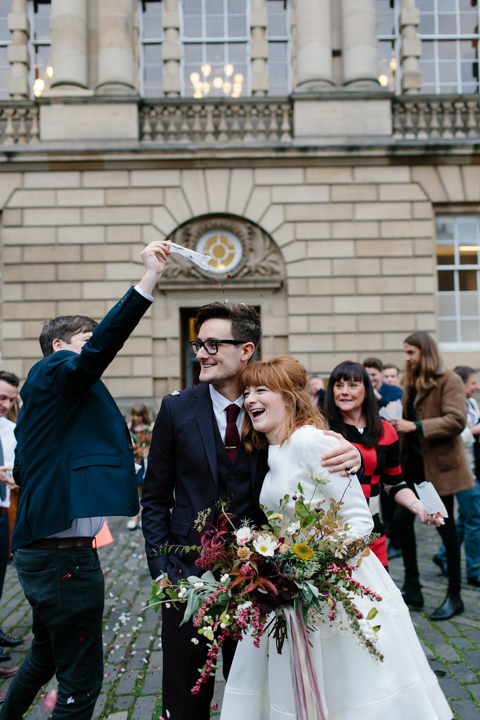 Lizzie wore a 1960's inspired short dress by Delphine Manivet for her intimate wedding in Edinburgh. Photography by Caro Weiss.