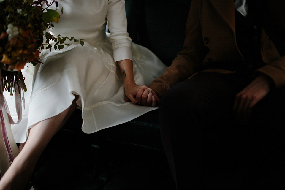 Lizzie wore a 1960's inspired short dress by Delphine Manivet for her intimate wedding in Edinburgh. Photography by Caro Weiss.