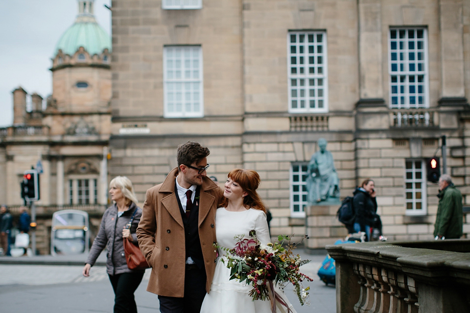 Lizzie wore a 1960's inspired short dress by Delphine Manivet for her intimate wedding in Edinburgh. Photography by Caro Weiss.