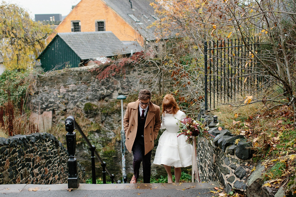 Lizzie wore a 1960's inspired short dress by Delphine Manivet for her intimate wedding in Edinburgh. Photography by Caro Weiss.