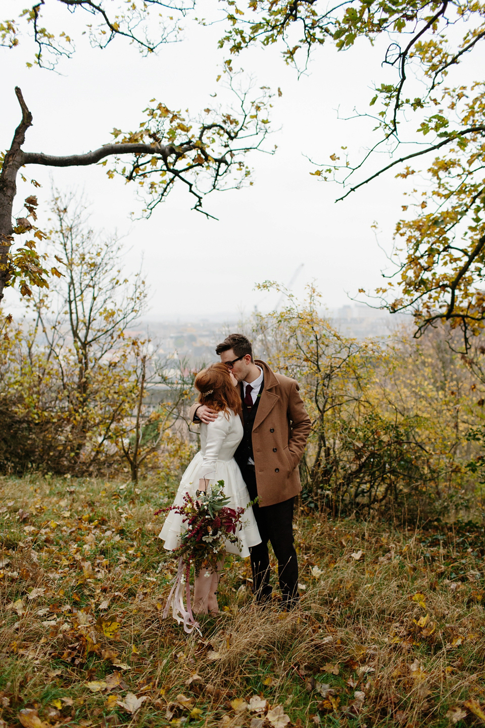 Lizzie wore a 1960's inspired short dress by Delphine Manivet for her intimate wedding in Edinburgh. Photography by Caro Weiss.