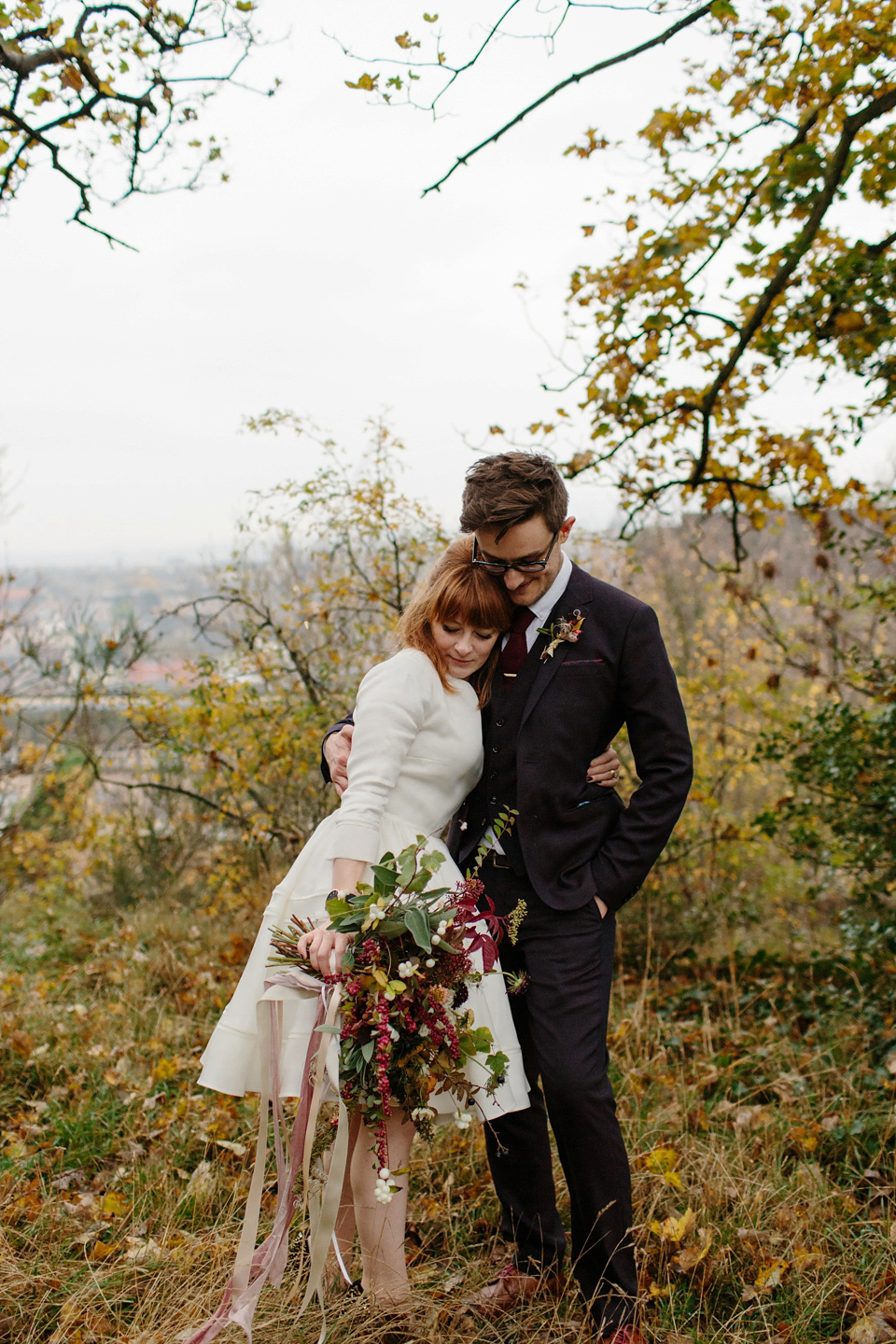 Lizzie wore a 1960's inspired short dress by Delphine Manivet for her intimate wedding in Edinburgh. Photography by Caro Weiss.