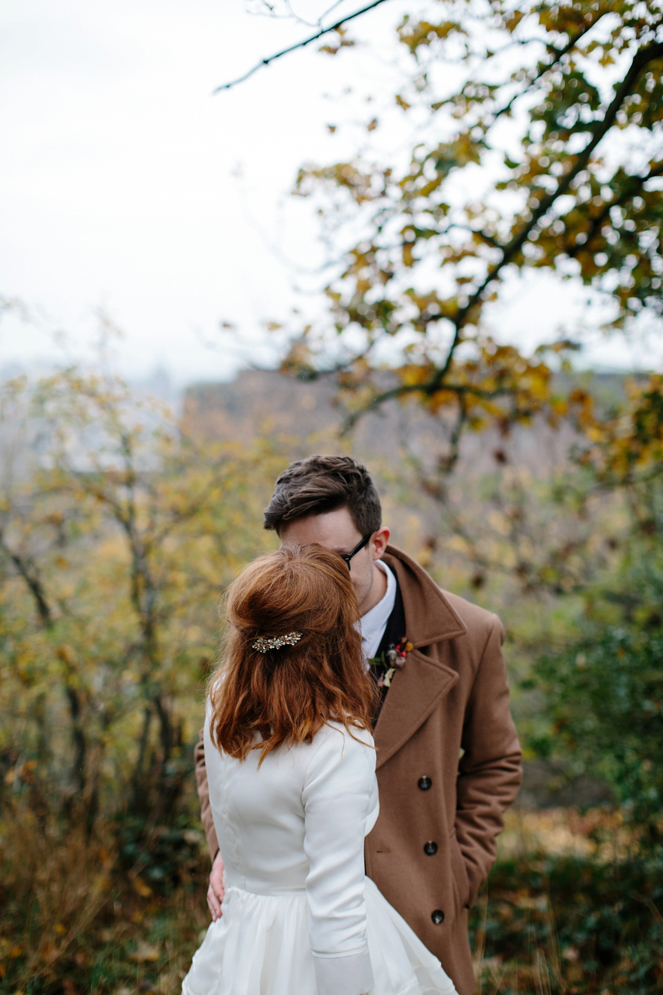 Lizzie wore a 1960's inspired short dress by Delphine Manivet for her intimate wedding in Edinburgh. Photography by Caro Weiss.