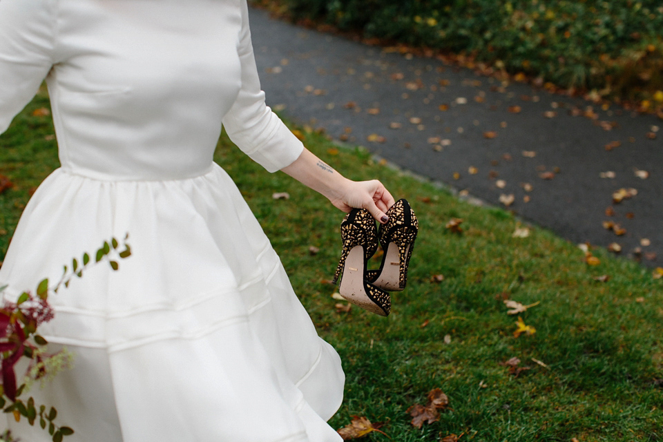 Lizzie wore a 1960's inspired short dress by Delphine Manivet for her intimate wedding in Edinburgh. Photography by Caro Weiss.