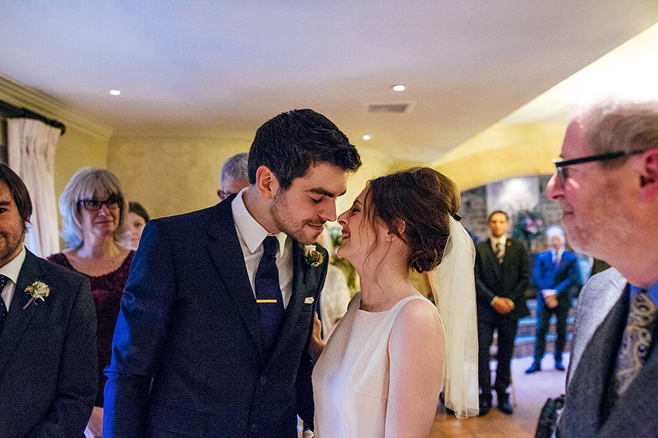 A short 60's inspired REDValentino dress for an Autumn wedding at Le Manoir Aux Quat'Saisons. Photography by Jordanna Marston.