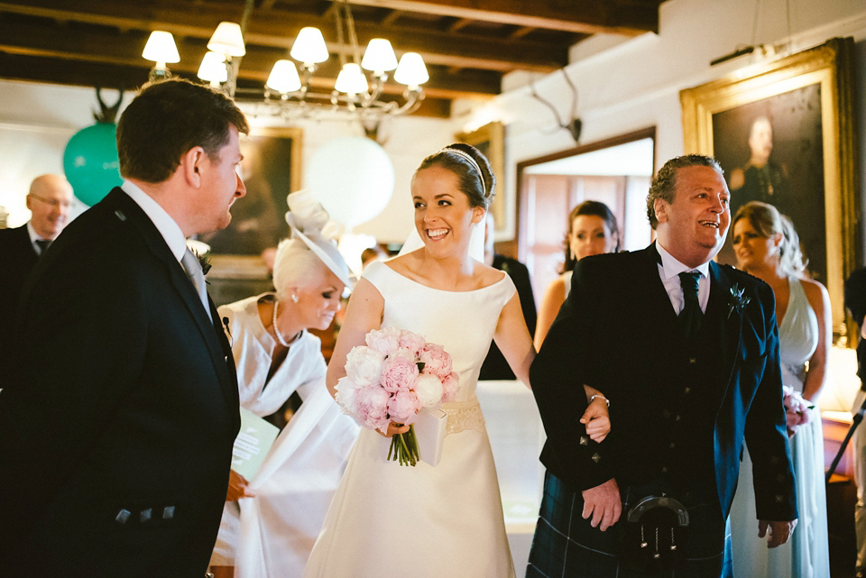 A Raimon Bundo gown for an elegant and intimate castle wedding in Scotland. Photography by Ed Godden.