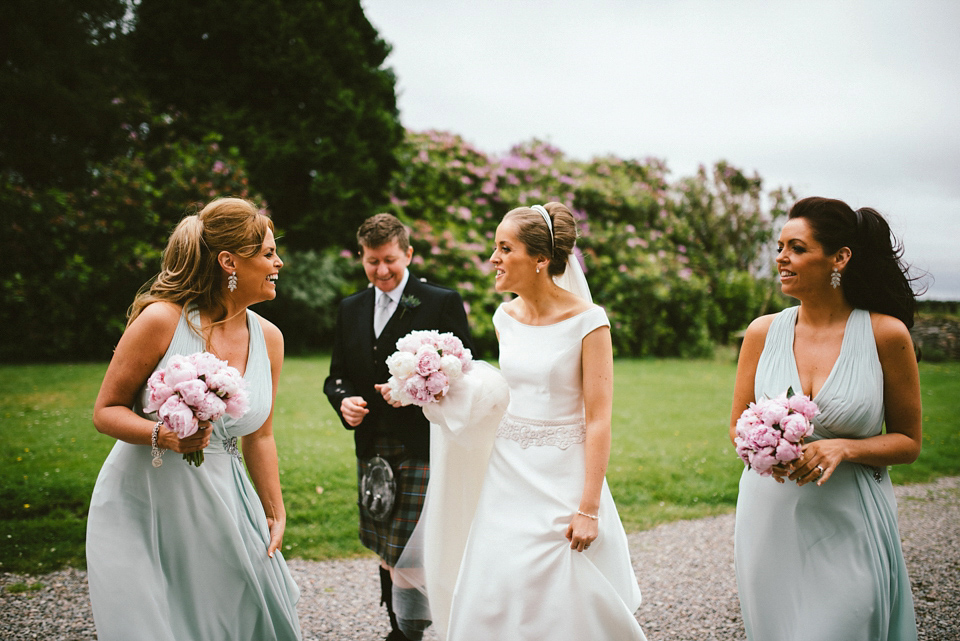 A Raimon Bundo gown for an elegant and intimate castle wedding in Scotland. Photography by Ed Godden.