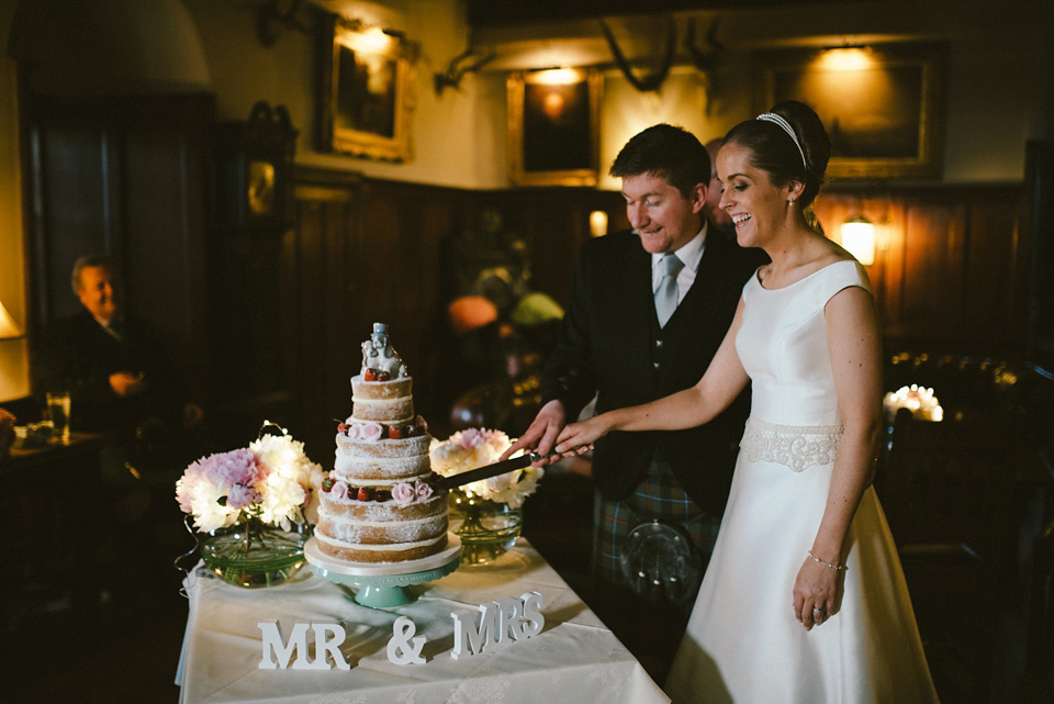 A Raimon Bundo gown for an elegant and intimate castle wedding in Scotland. Photography by Ed Godden.