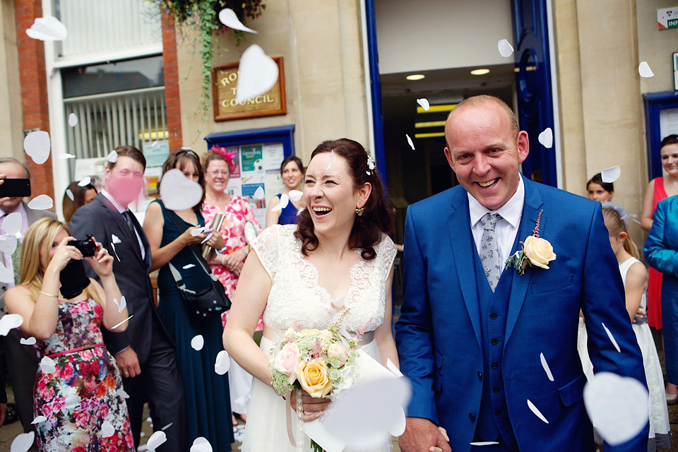 A Claire Pettibone dress for a British and French Summer garden party wedding. Photography by Lydia Stamps.