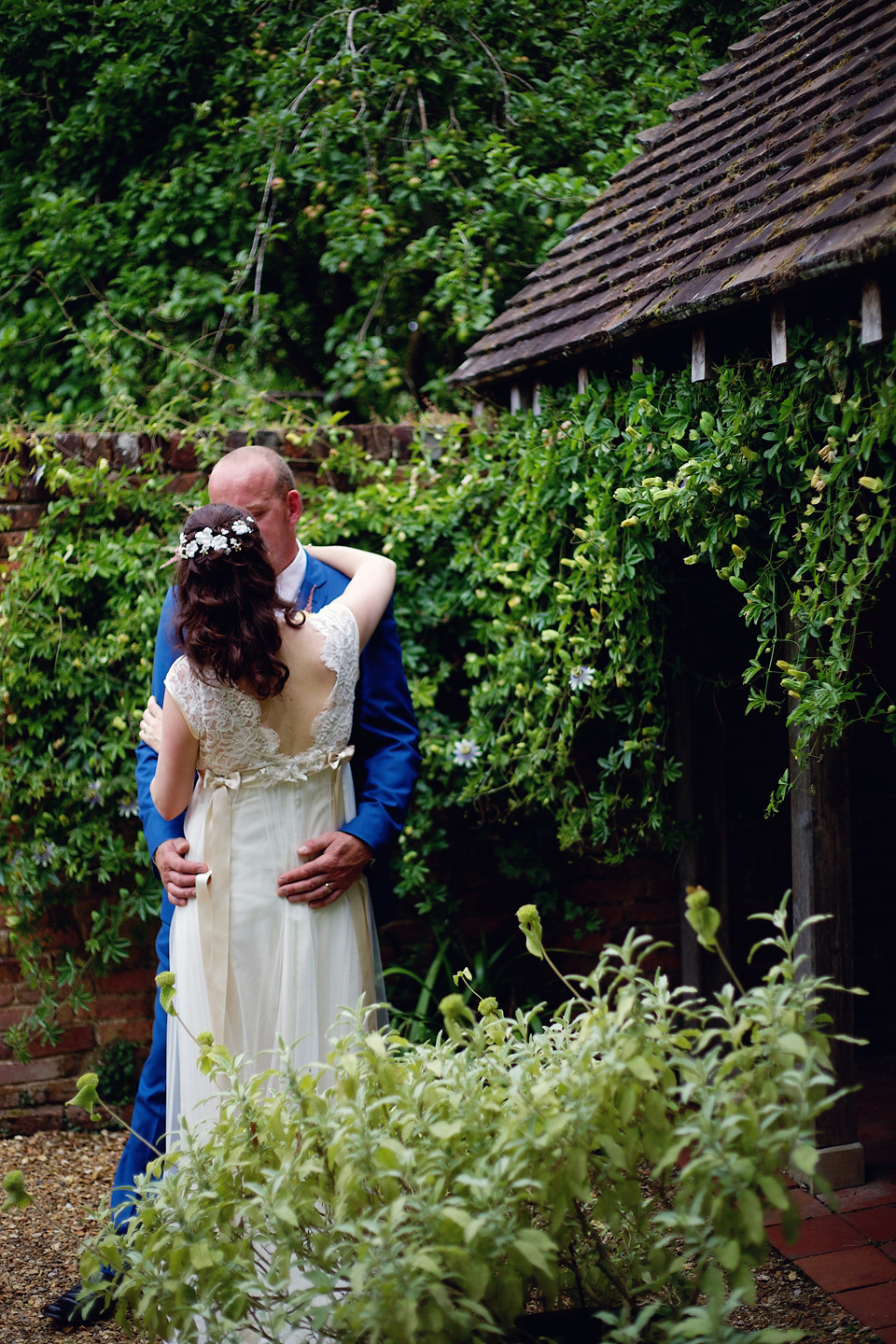 A Claire Pettibone dress for a British and French Summer garden party wedding. Photography by Lydia Stamps.